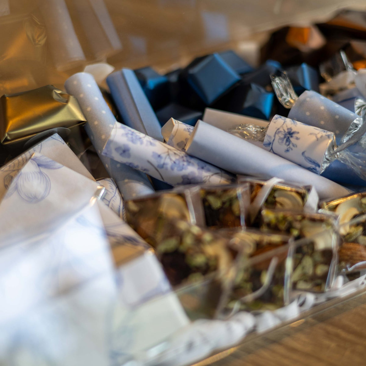 The Blue Toile Tray, close view of the navy foils and the toile wrapped batons
