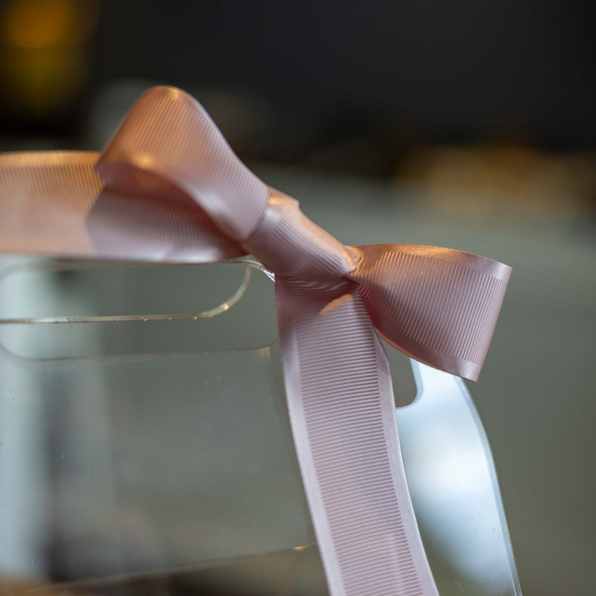 The Blush Carry Case, close view of the blush grosgrain bow
