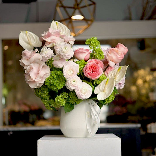 Colette, the full arrangement in its white vase, showing its scale